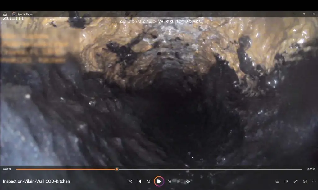 Corroded cast iron sewer pipe interior before cleaning